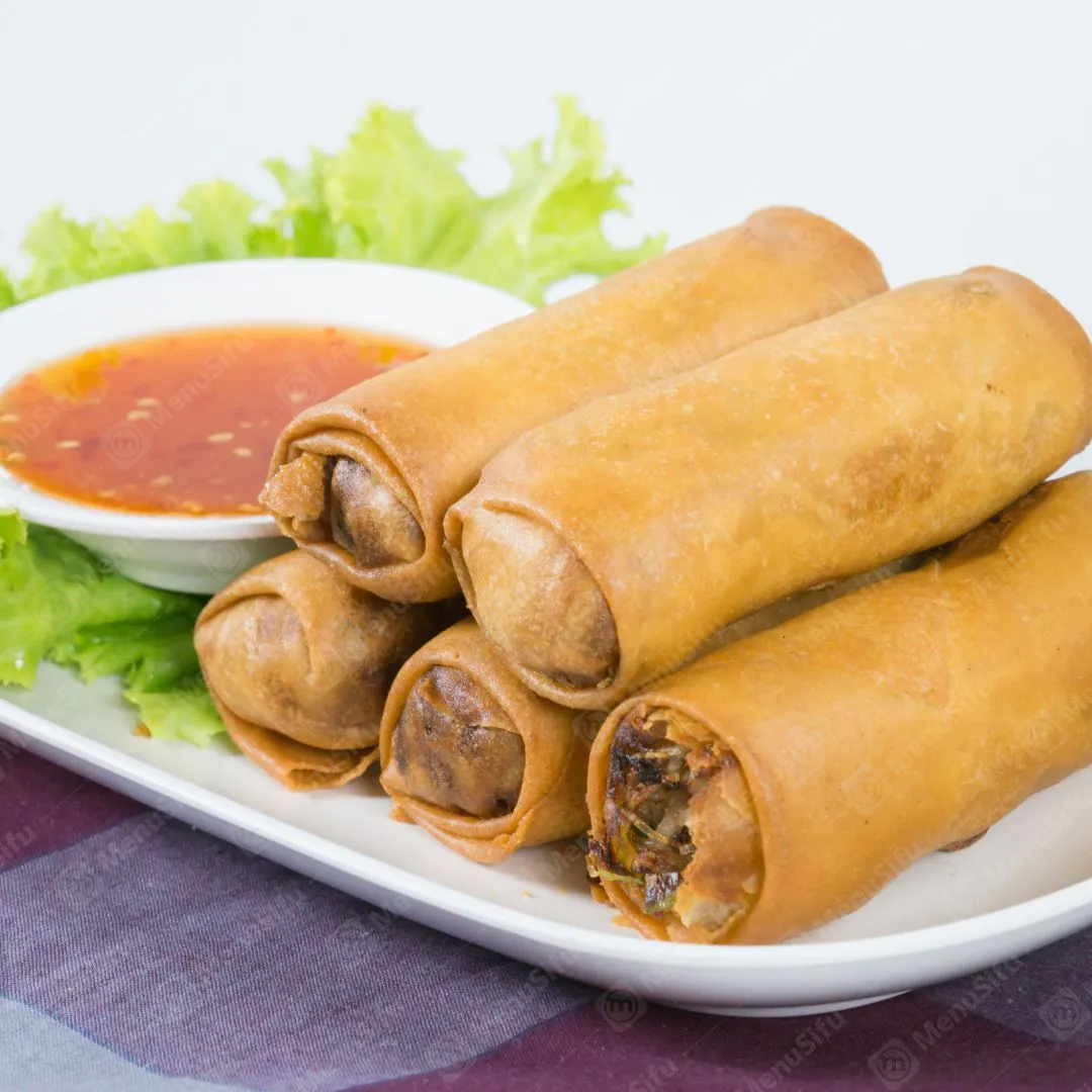 Crispy fried spring rolls with sweet chili dipping sauce and lettuce at Chinese Wok, a Chinese Restaurant in Seymour